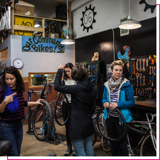 Group of young women working on bikes in Vancouver